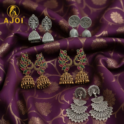 Elegant stone-accented peacock temple earrings in antique gold and oxidized silver finish