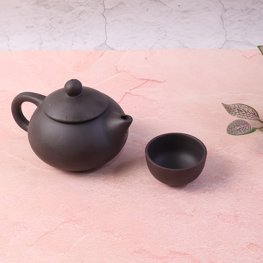 Traditional oriental style ceramic teapot and cups