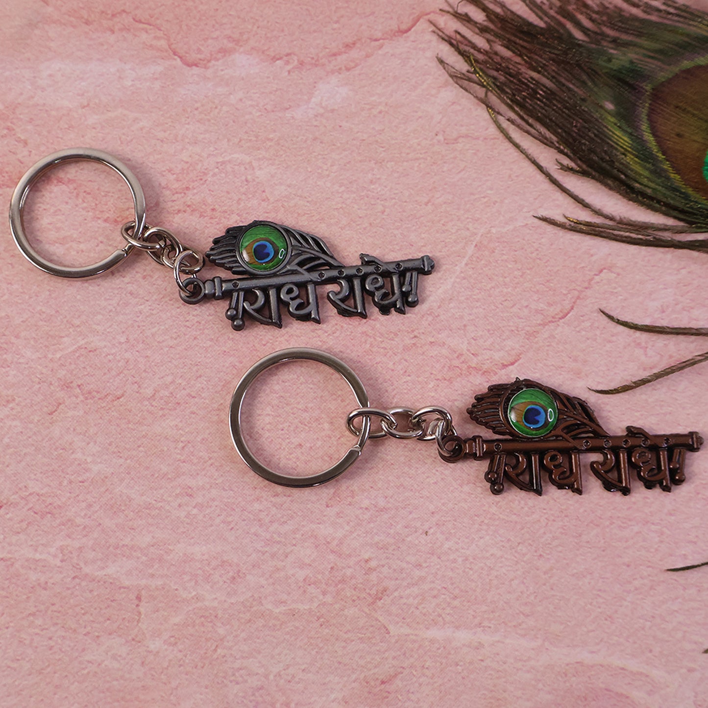 Radhe Radhe Metal Keychain with Peacock Feather Design – Divine Copper Finish (Mix Color) (1 Pc)