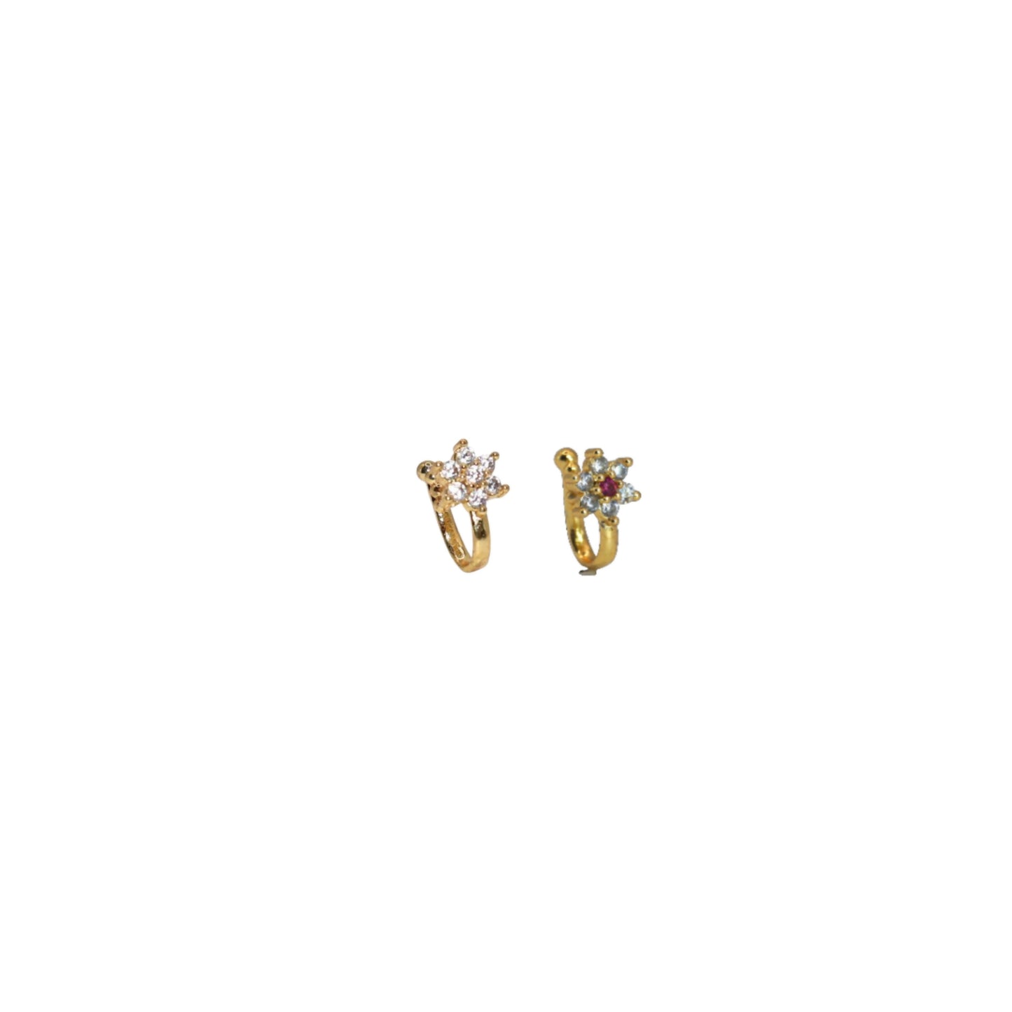Close-up of gold-plated traditional floral nose ring with ruby-colored stone