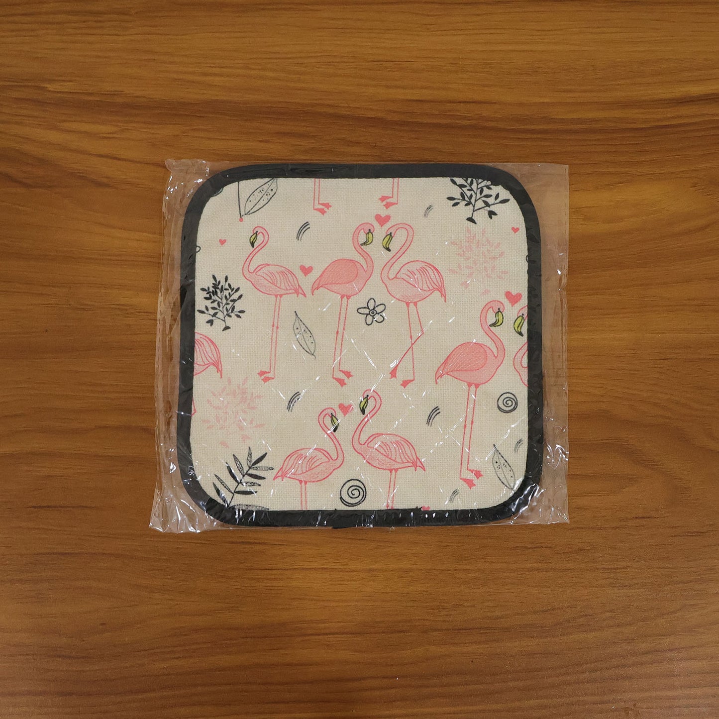 Printed heat resistant kitchen pot holder mat in use