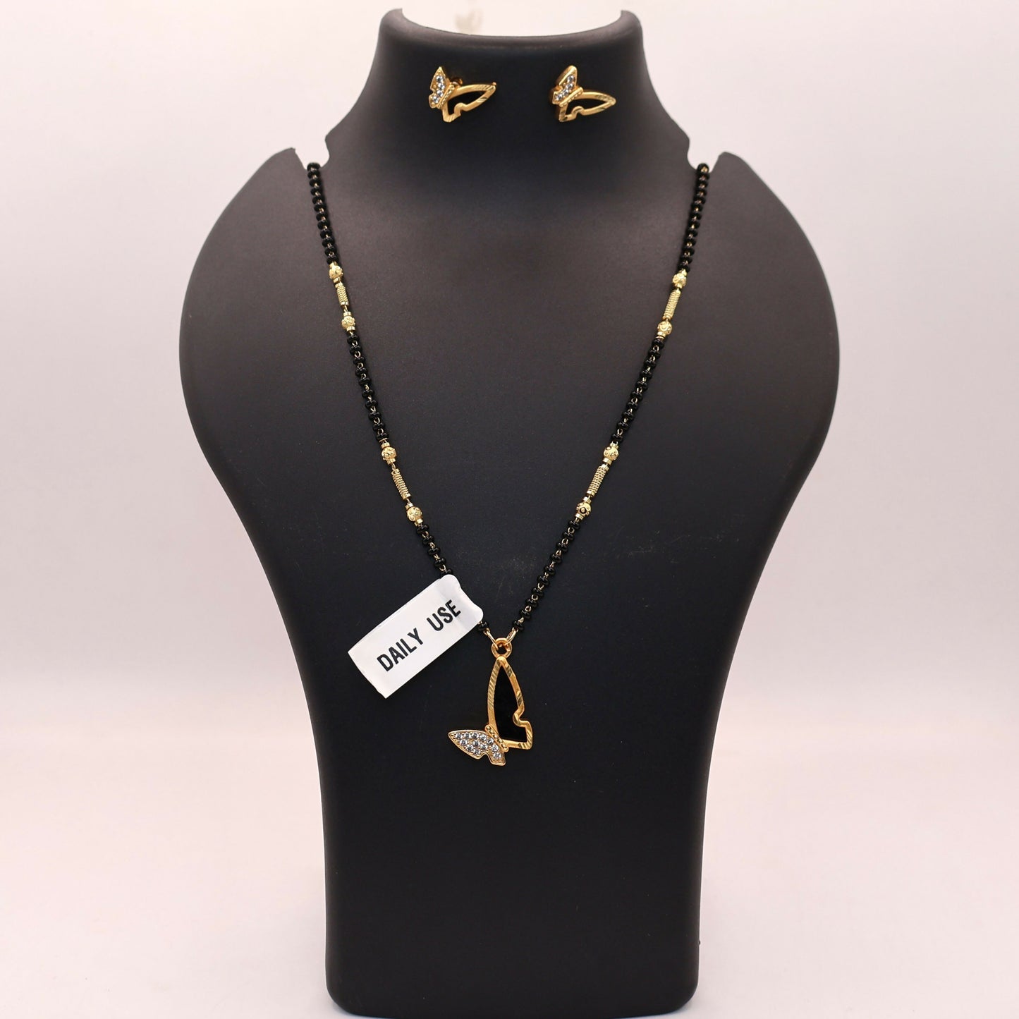 Gold-plated dual-tone butterfly earrings from the mangalsutra set