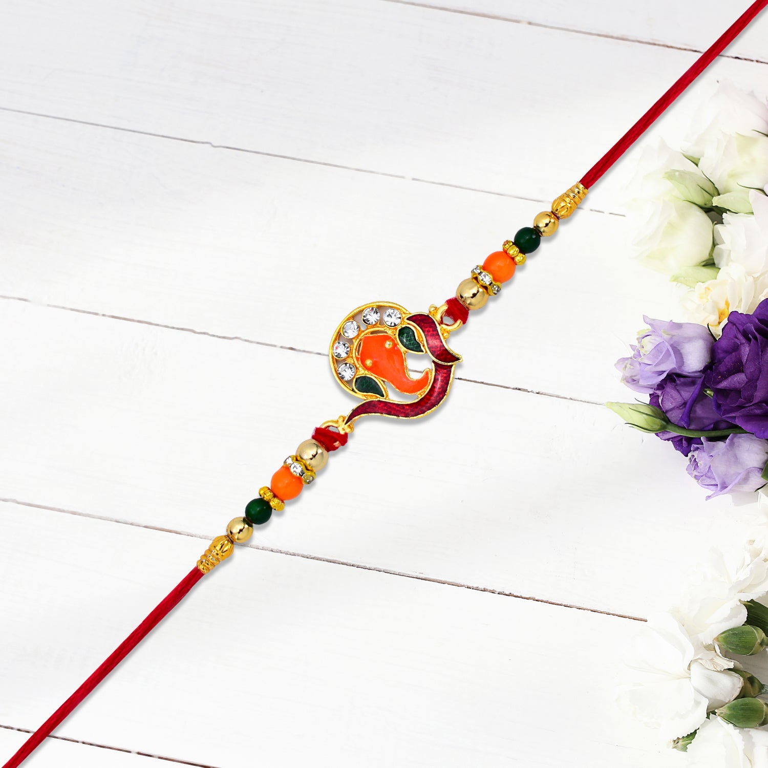 Detailed view of stone settings on Golden Ganesha Rakhi