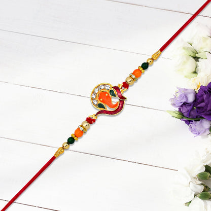 Golden Ganesha Rakhi showcasing bead and stone arrangement