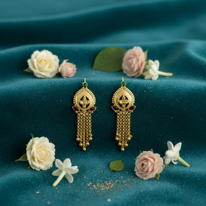 Gold-plated jhumka earrings showing intricate filigree and colorful enamel accents