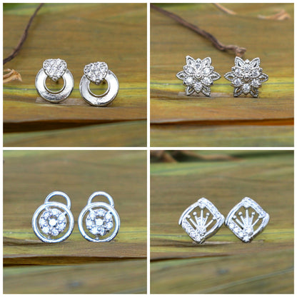 Silver tone stud earrings set displayed showcasing sparkling cubic zirconia stones