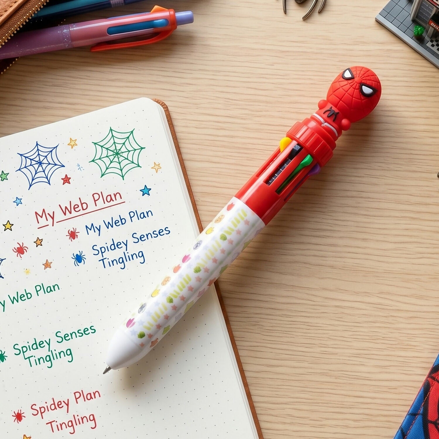 10-Color Superhero Multi-Ink Ball Pen with colorful inks and superhero topper
