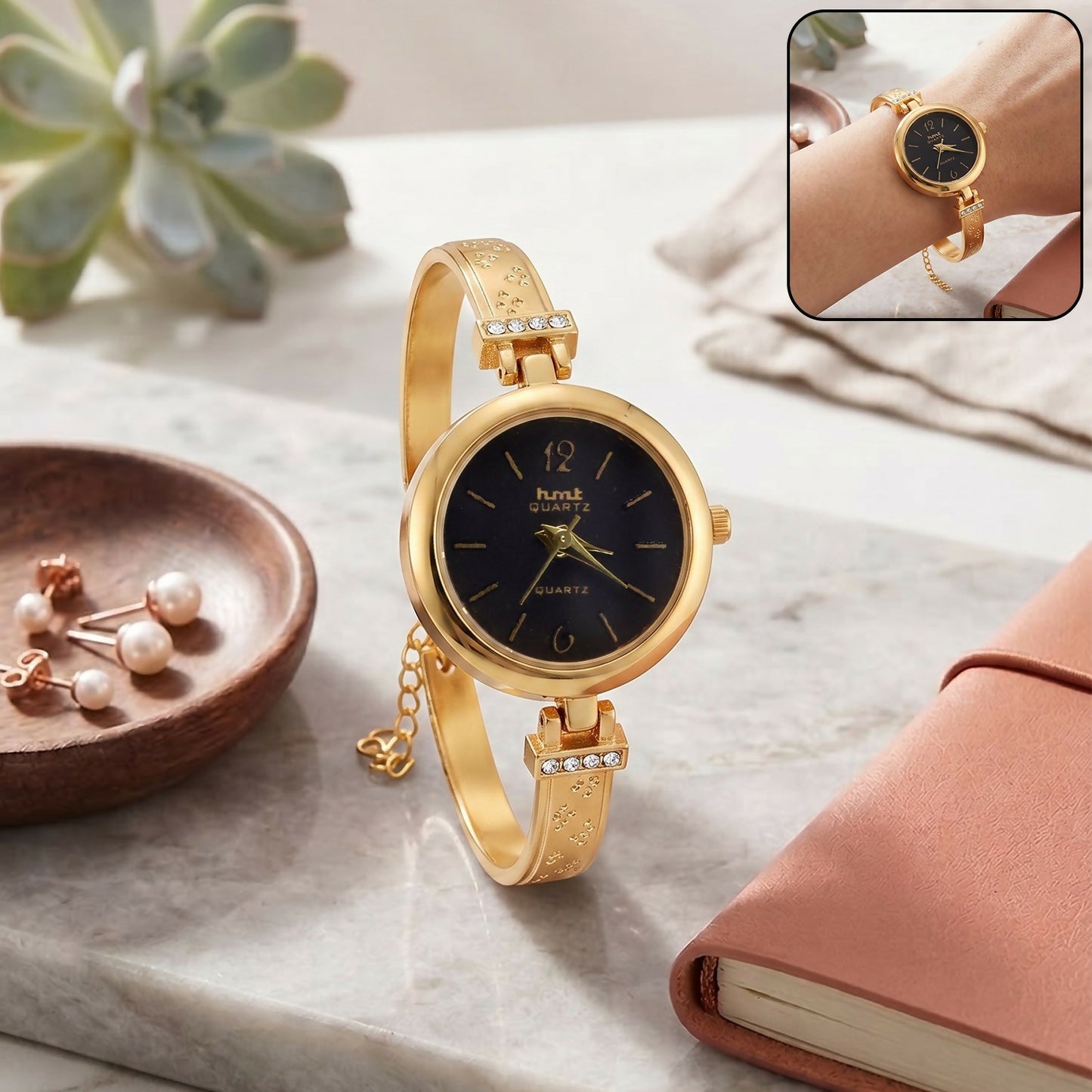 Elegant golden charm bracelet-style watch front view