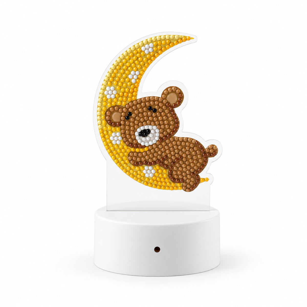A white base with a clear acrylic panel featuring a diamond painting of a brown teddy bear on a yellow moon.