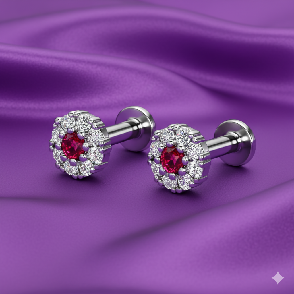 Close-up of silver plated ruby halo earrings showcasing brilliant white stone halo