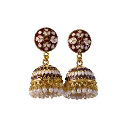 Pearl beads hanging from maroon jhumka earrings