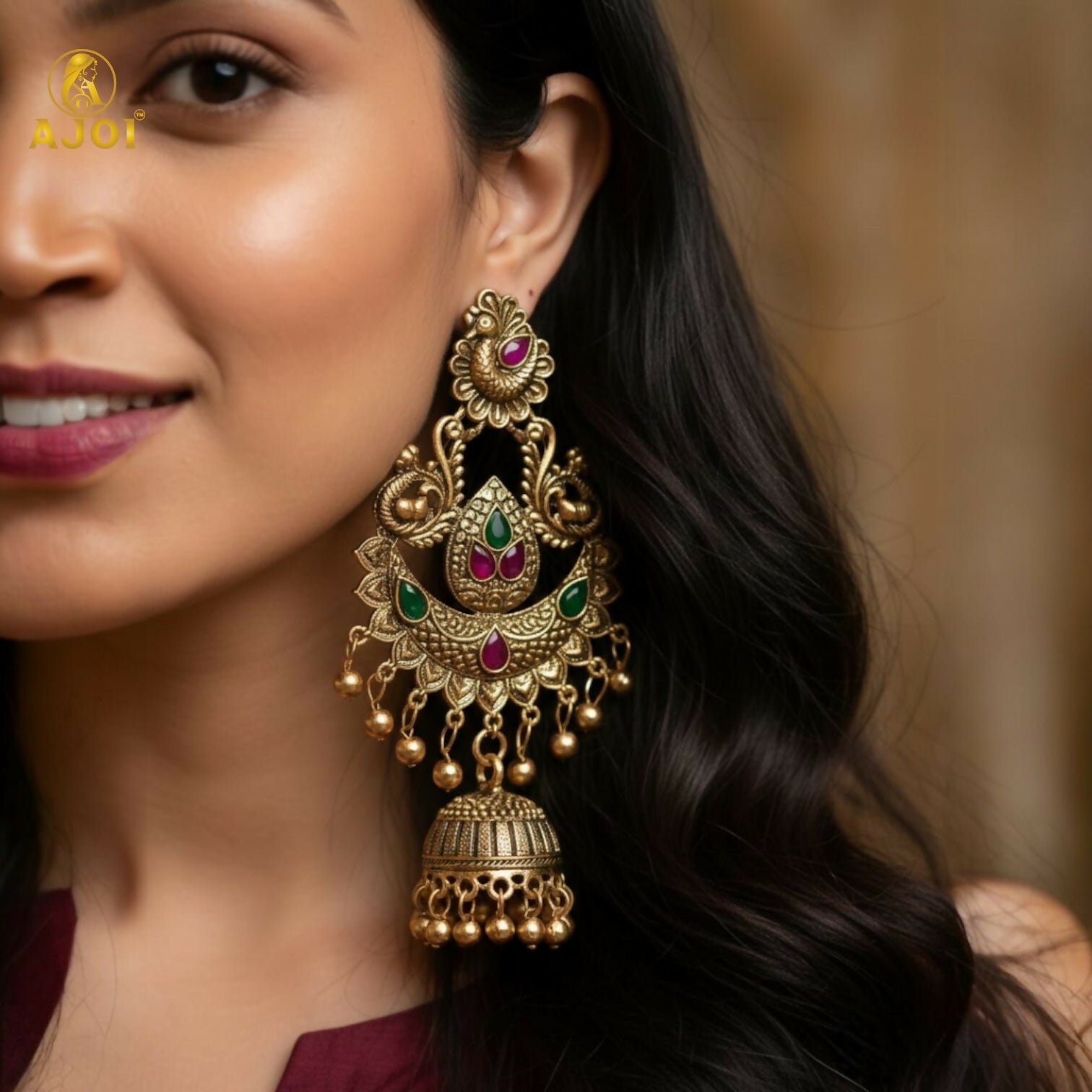 Side angle of gold plated peacock jhumka earrings showing intricate design