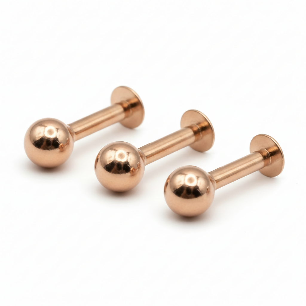 Set of three rose gold labret stud earrings in combo pack arrangement