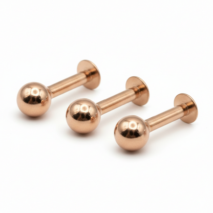 Set of three rose gold labret stud earrings in combo pack arrangement