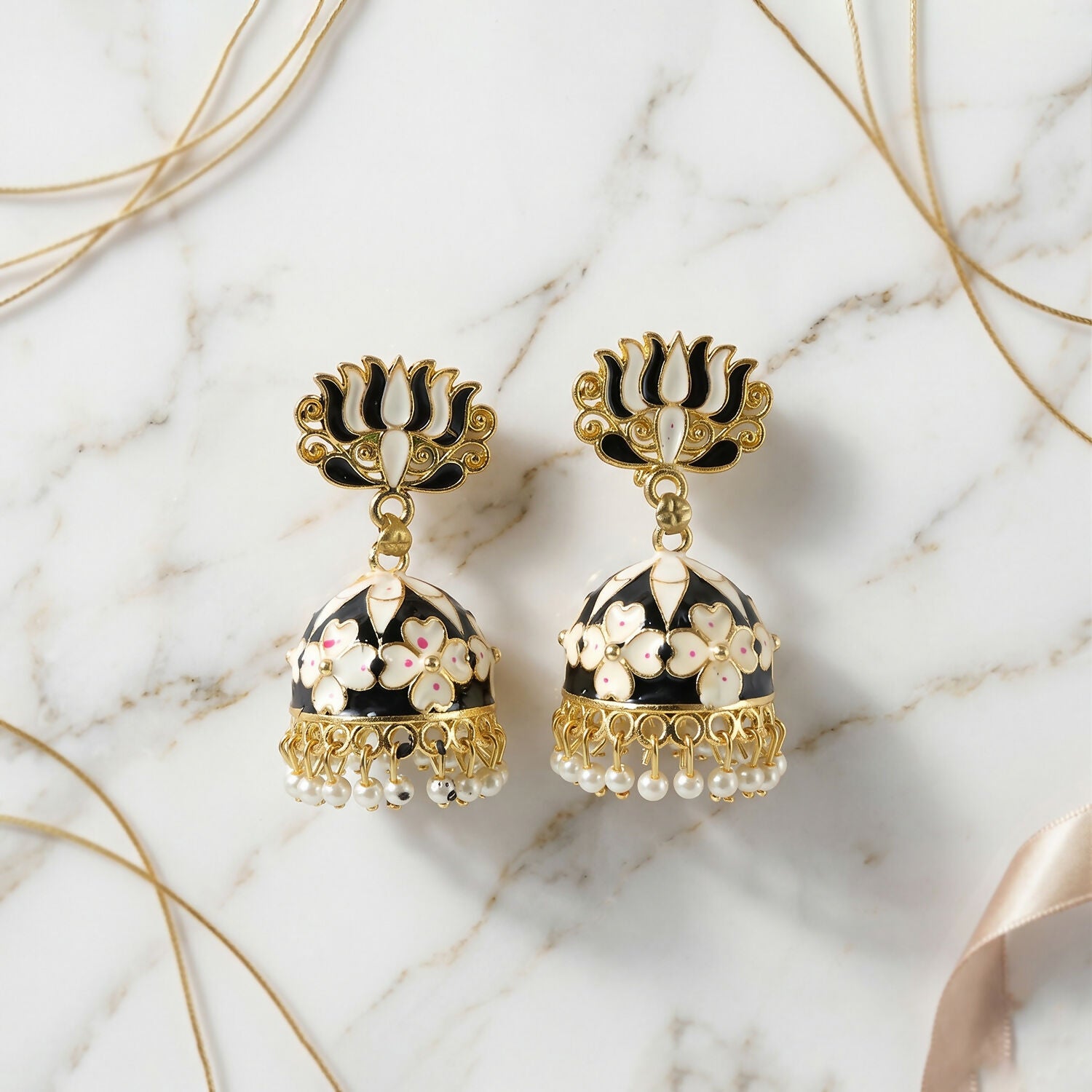 Black lotus jhumka earrings worn with ethnic outfit