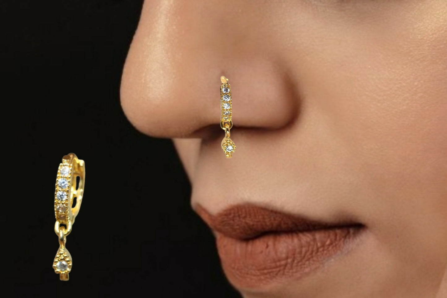 Close-up of gold plated dangle nose ring featuring sparkling white CZ stones and teardrop charm