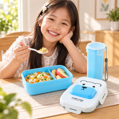 A white and blue lunchbox with a bear face design and a blue water bottle on a clean white surface.