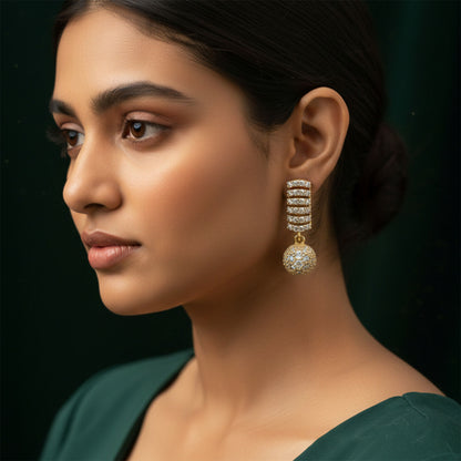 Detailed image of delicate hanging ball design on CZ studded drop earrings