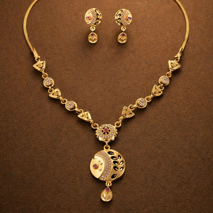 Close-up of gold-tone beaded chain necklace with sparkling stones
