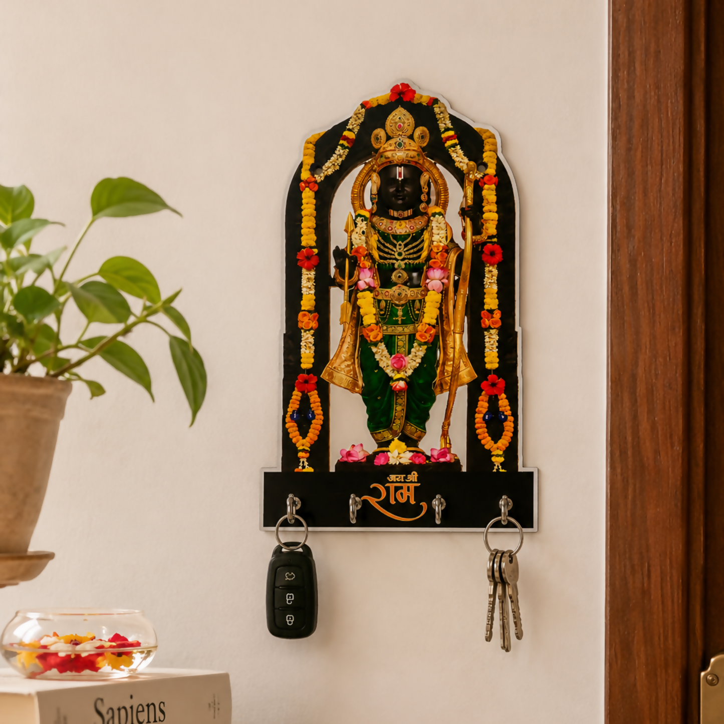 Handcrafted wooden wall key holder featuring divine idol artwork and four hooks for keys and accessories