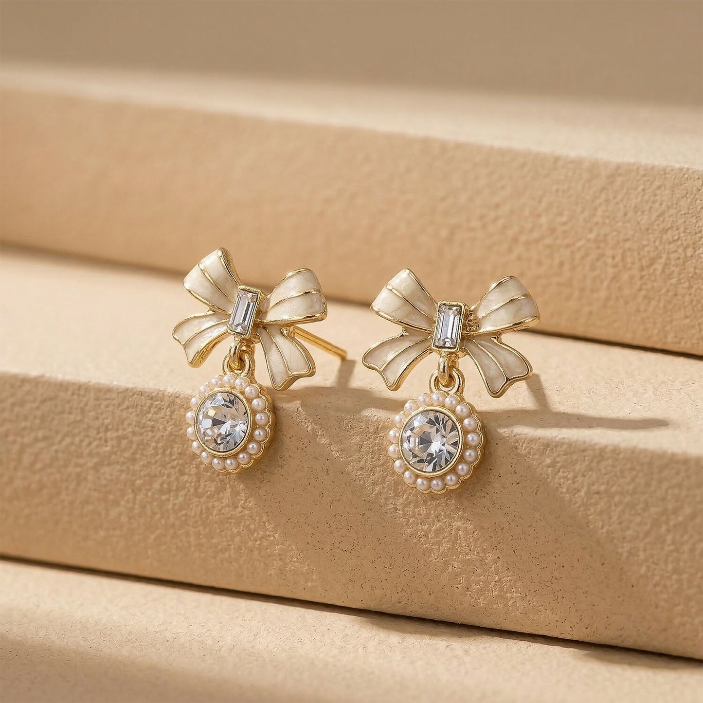 Side view of lightweight gold plated bow crystal earrings