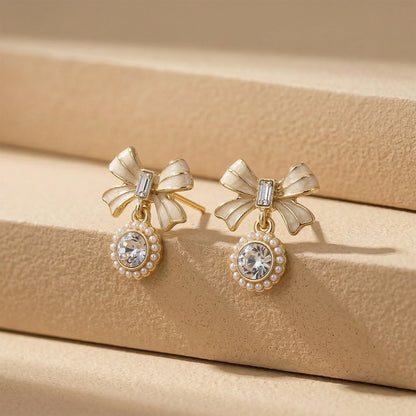 Side view of lightweight gold plated bow crystal earrings