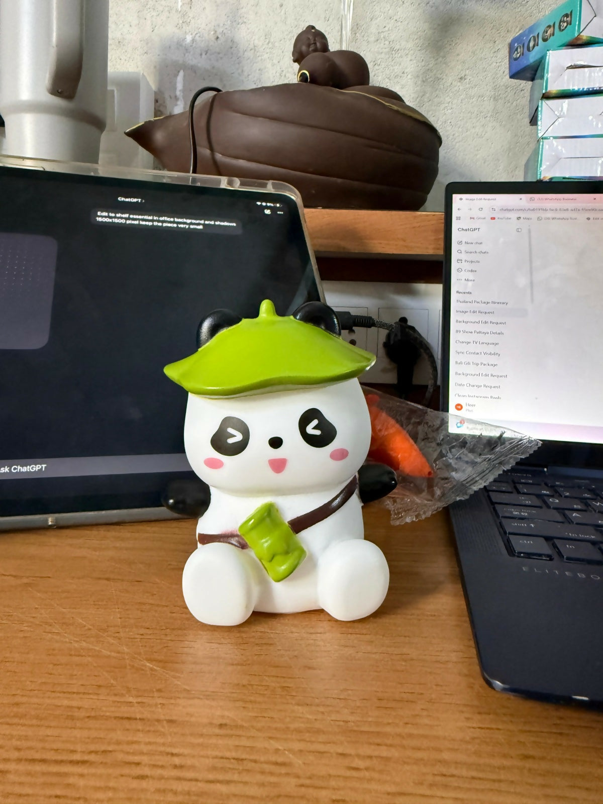 Decorative panda night lamp with green hat glowing softly