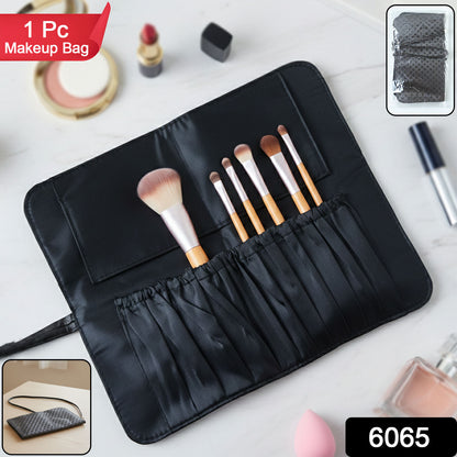 Compact makeup brush organizer pouch open with multiple slots