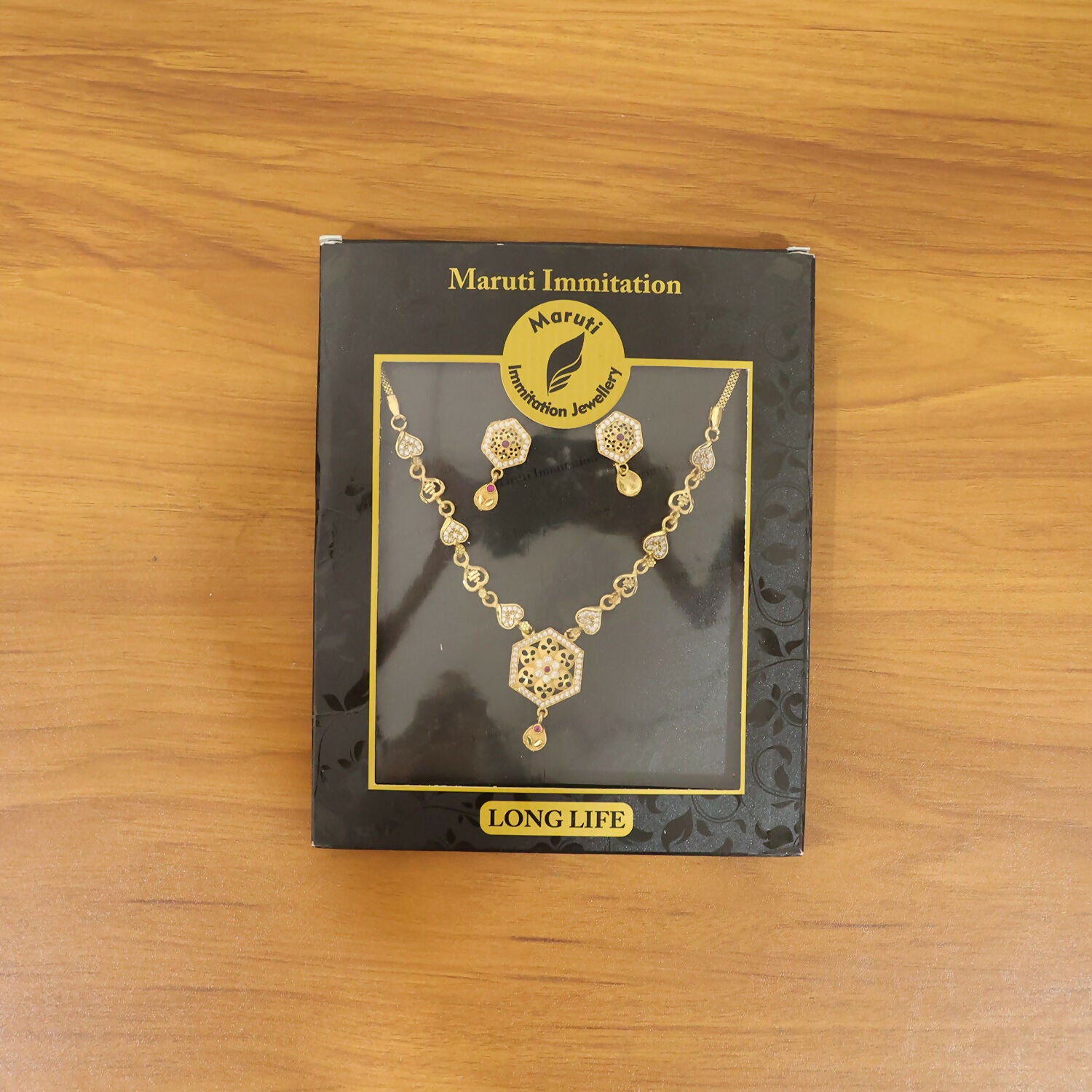 Complete designer jewelry set with pendant necklace and matching earrings
