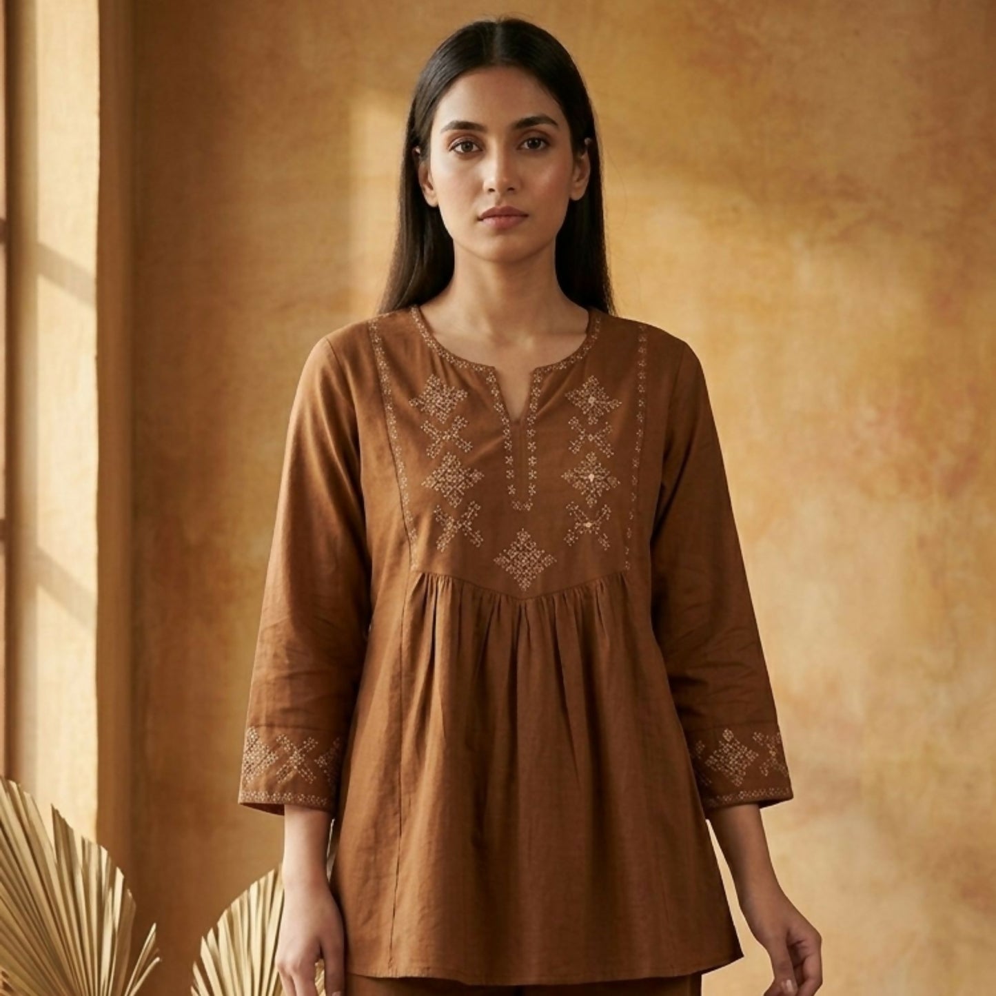 Close-up of floral embroidery on brown co-ord kurti set for women