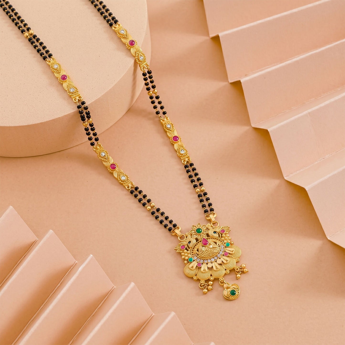 Side view of the floral lotus pendant showcasing pink enamel petals and intricate design