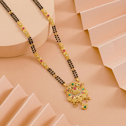 Side view of the floral lotus pendant showcasing pink enamel petals and intricate design