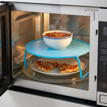 Elevated spacer tray for microwave cooking