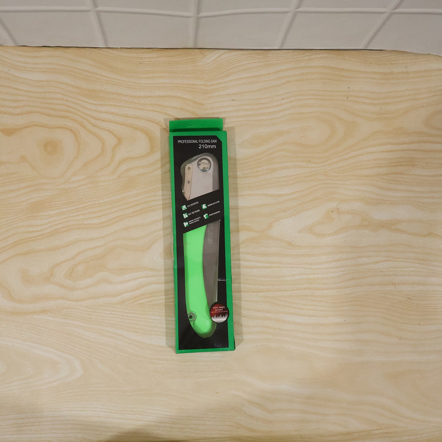 Full view of garden folding saw with blade extended for pruning and wood cutting