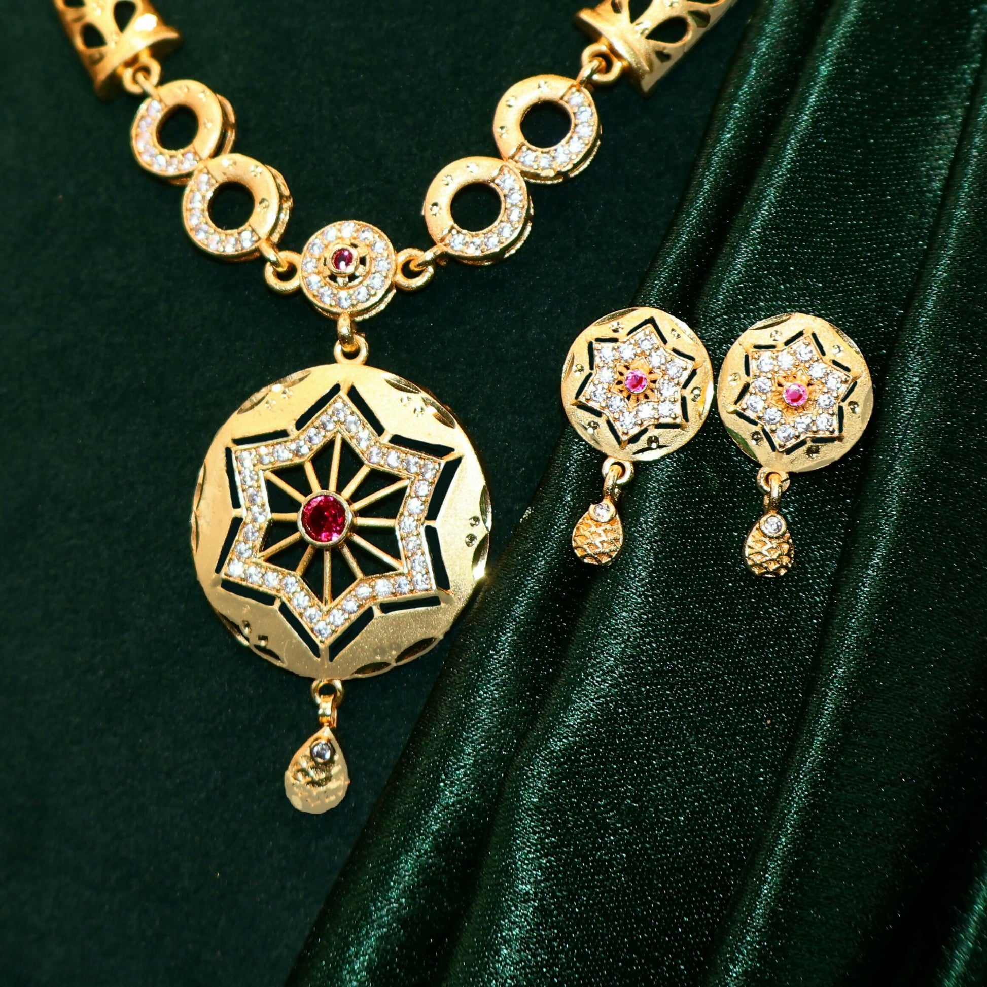 Gold Plated Star Pendant Forming Necklace Set with AD & Ruby Accents