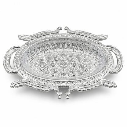 Empty silver-colored ornate serving tray with intricate embossed patterns on a white background.