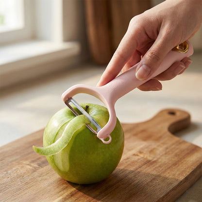 Compact handheld vegetable peeler with ergonomic design