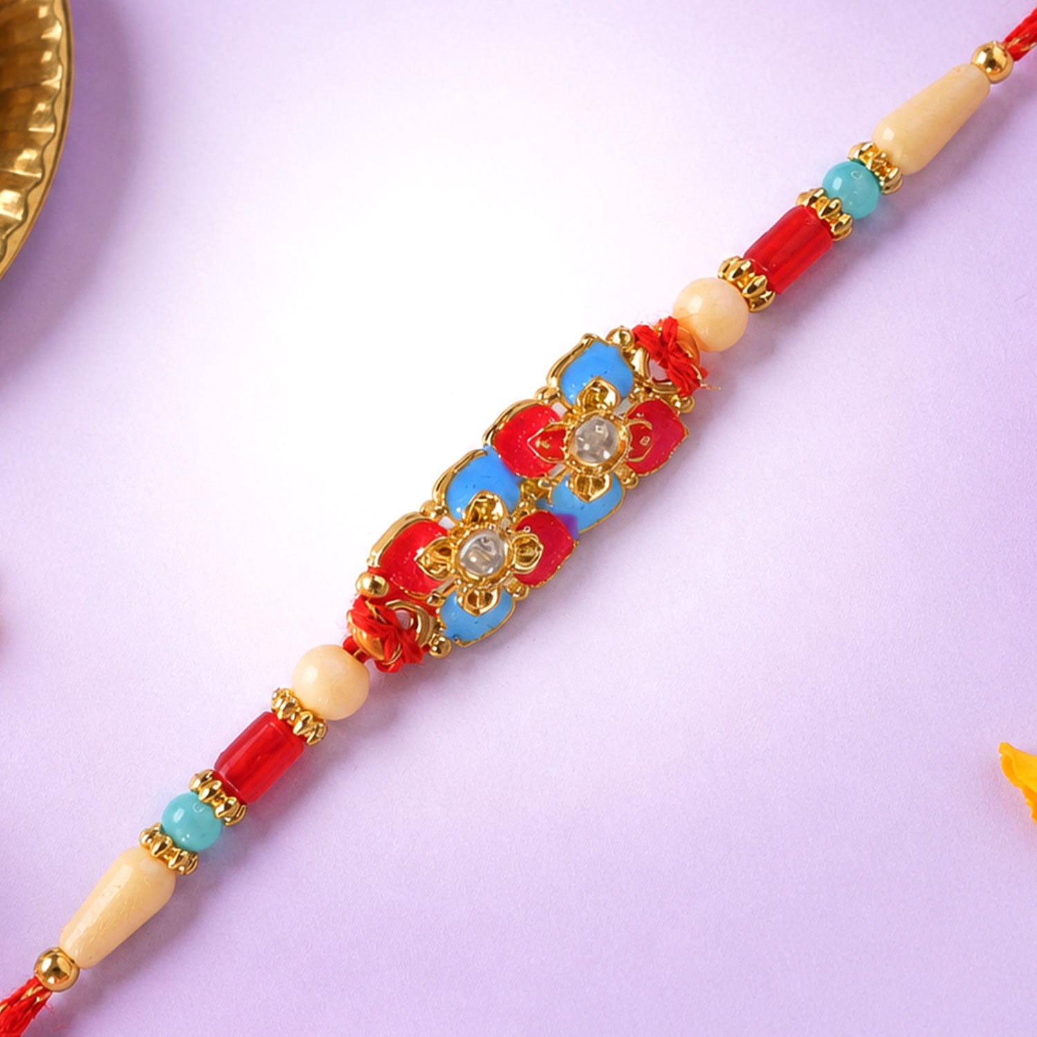 Multicolor Floral Kundan Pendant Rakhi with Red and Blue Beads