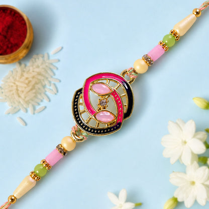Black and Pink Enamel Spiral Pendant Rakhi with Pastel Beads