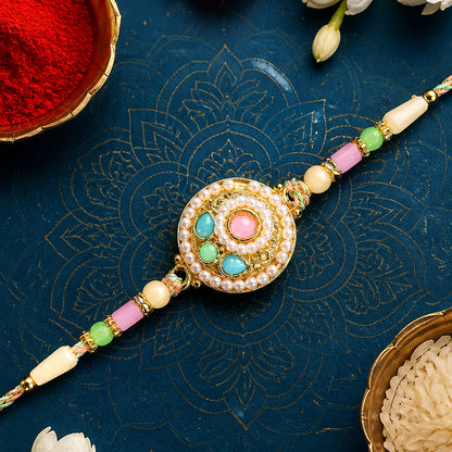 Pearl Bordered Round Pendant Rakhi with Turquoise and Pink Center