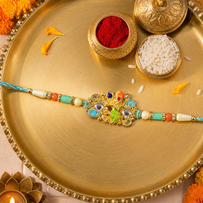 Oxidized Kundan Cluster Pendant Rakhi with Teal and Coral Beads