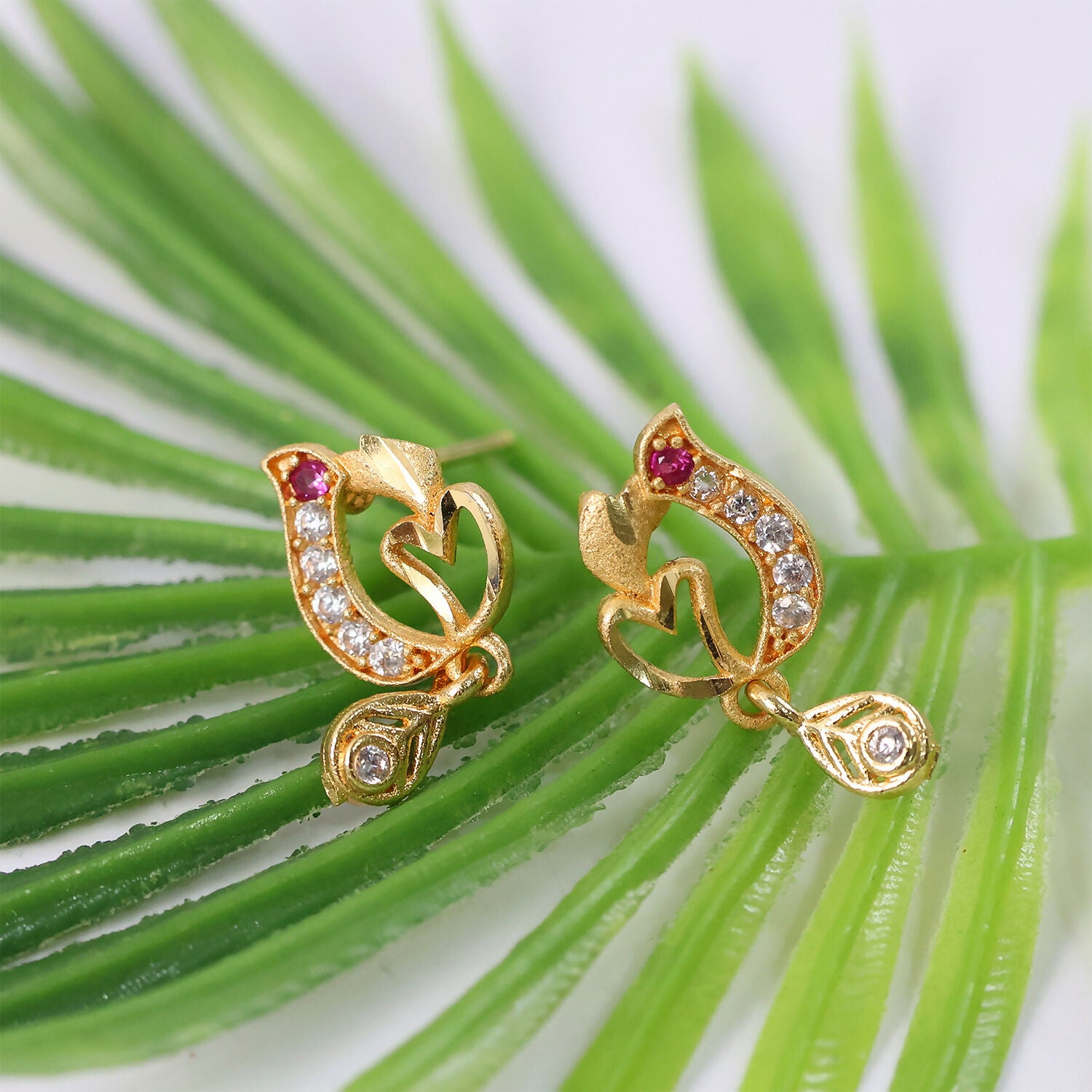 Artistic Leaf Motif Gold Stud Earrings With Crystal Highlights And Drop Finish