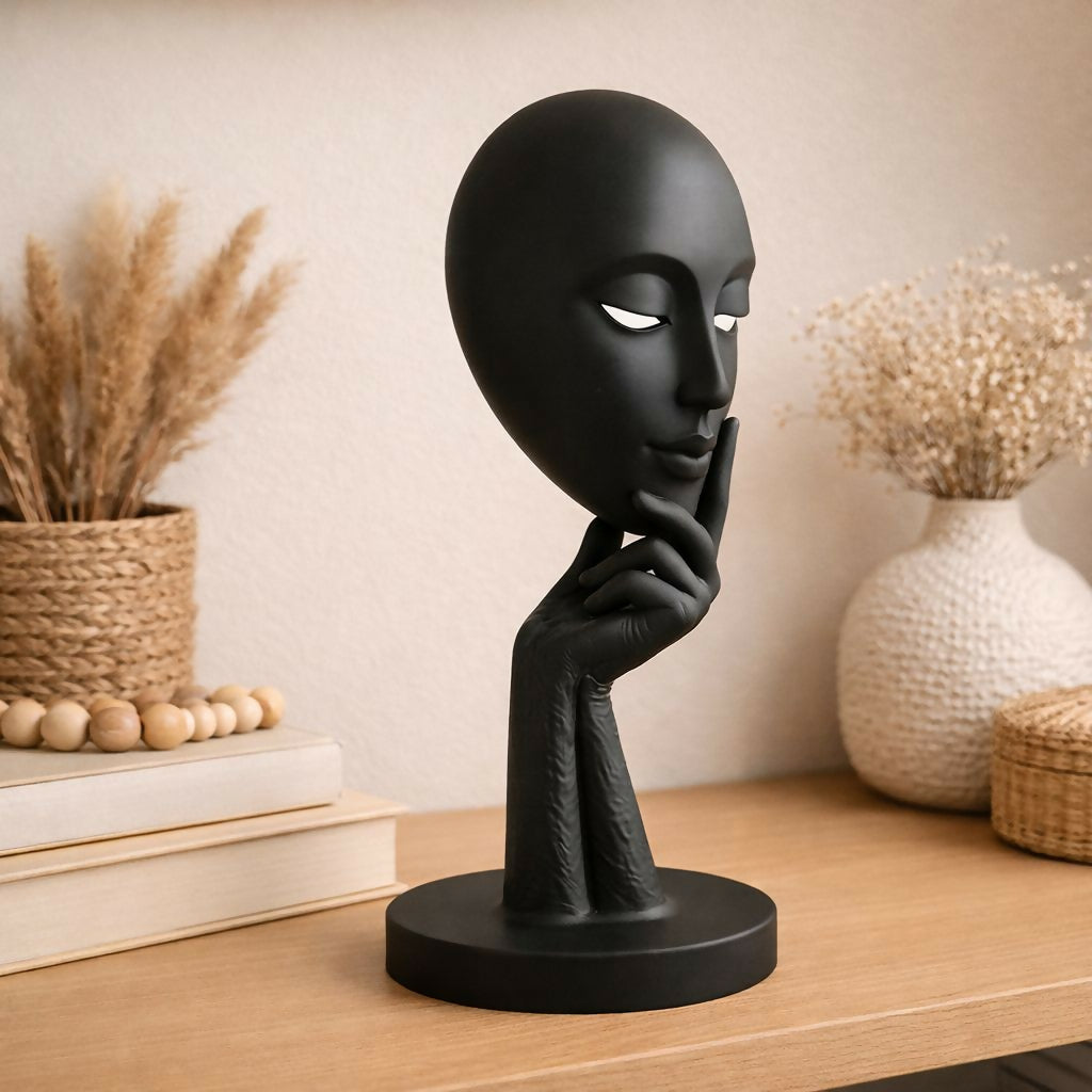 Close-up of thoughtful expression on abstract face sculpture