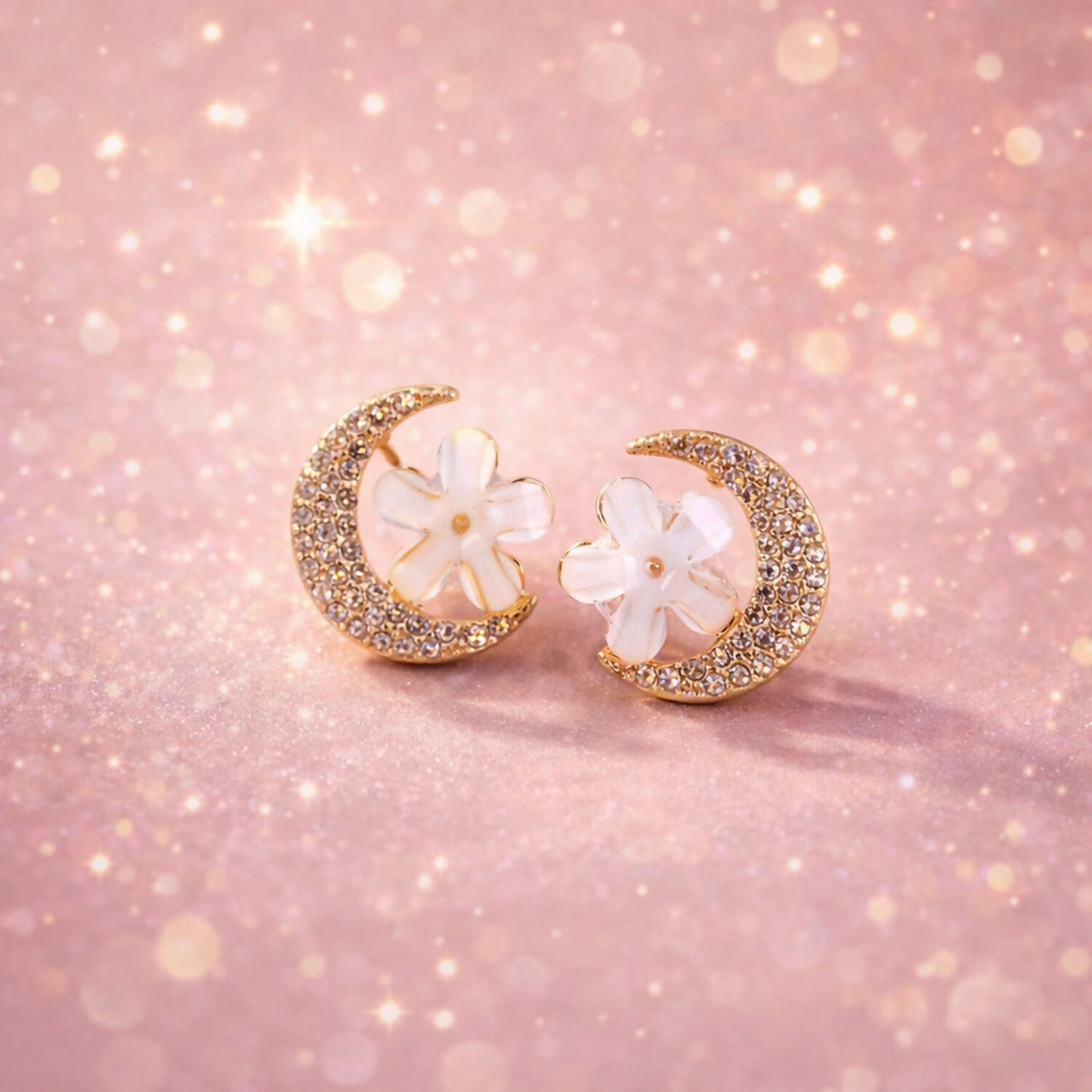 Gold crystal stud earrings with moon and flower design