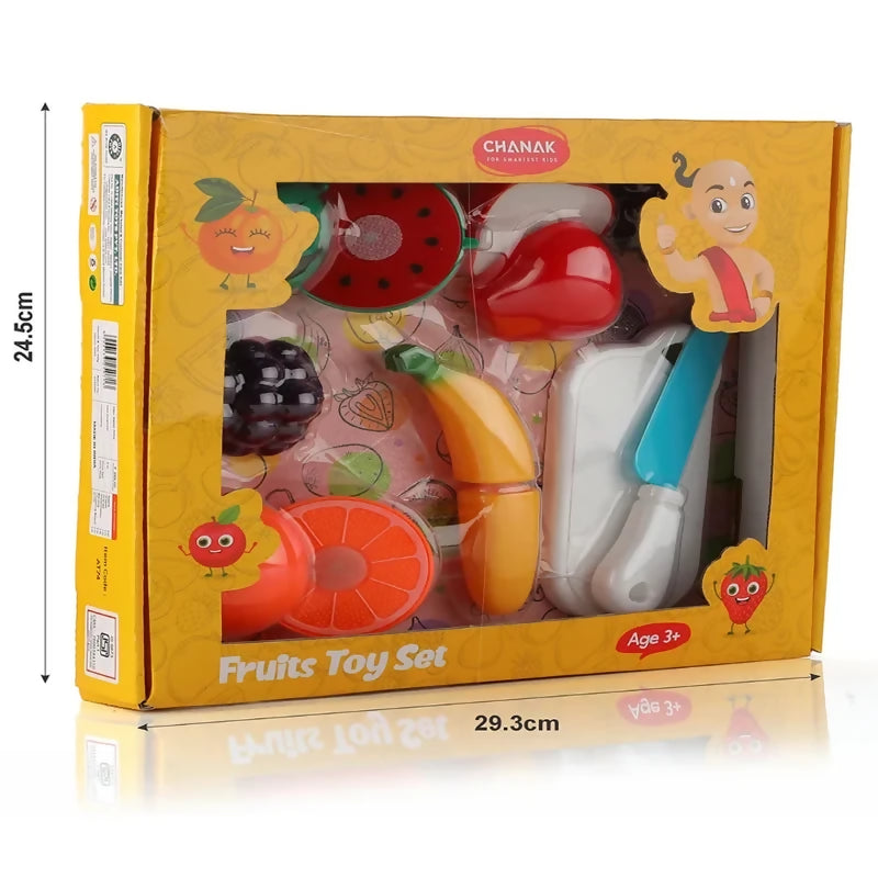 A yellow box containing plastic fruit toys, a knife, and a chopping board, with dimensions 24.5cm by 29.3cm.