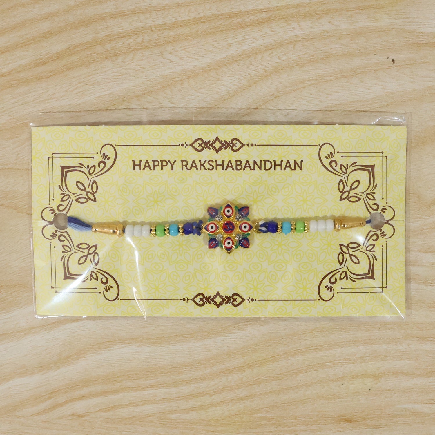 Multi Evil Eye OM Star Designer Rakhi with thread spread out
