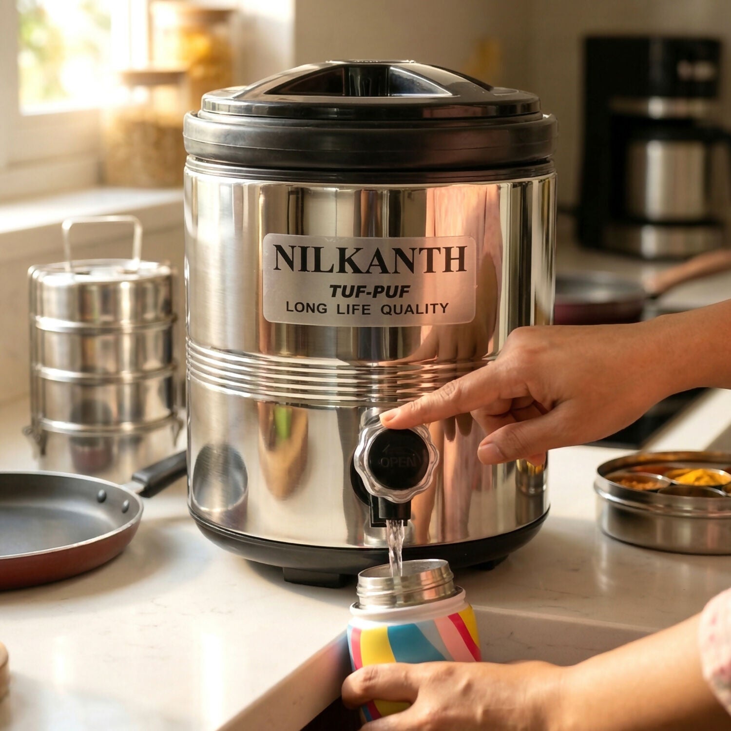 Pouring water through tap of Nilkanth Splash 6000 dispenser