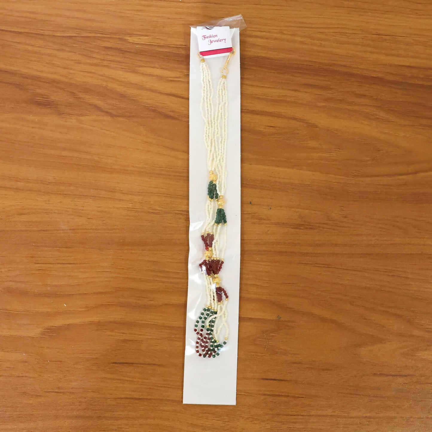 Elegant pearl mala necklace featuring red and green bead accents