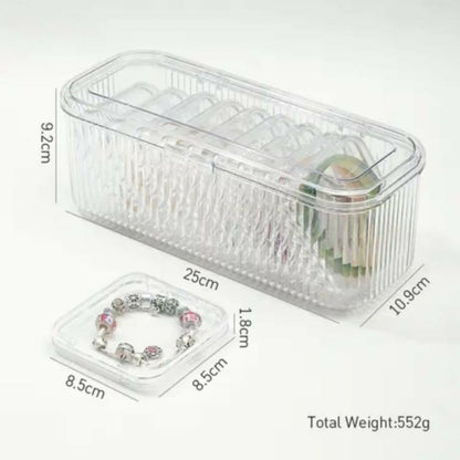A clear, ribbed plastic storage box and a small square container are shown with their dimensions in centimeters and total