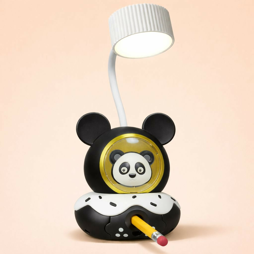 A yellow pencil is inserted into the front sharpener of the panda lamp, set on a light pink surface.